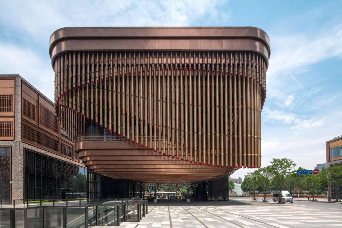 Rose Gold PVD stainless steel tubular façade at the Arts and Cultural Centre, Shanghai Bund Financial Centre.
